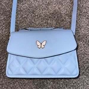 Butterfly purse and matching wallet! Never been used and brand new without tags